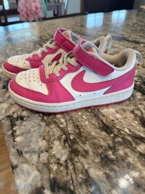 Youth pink Nike shoes